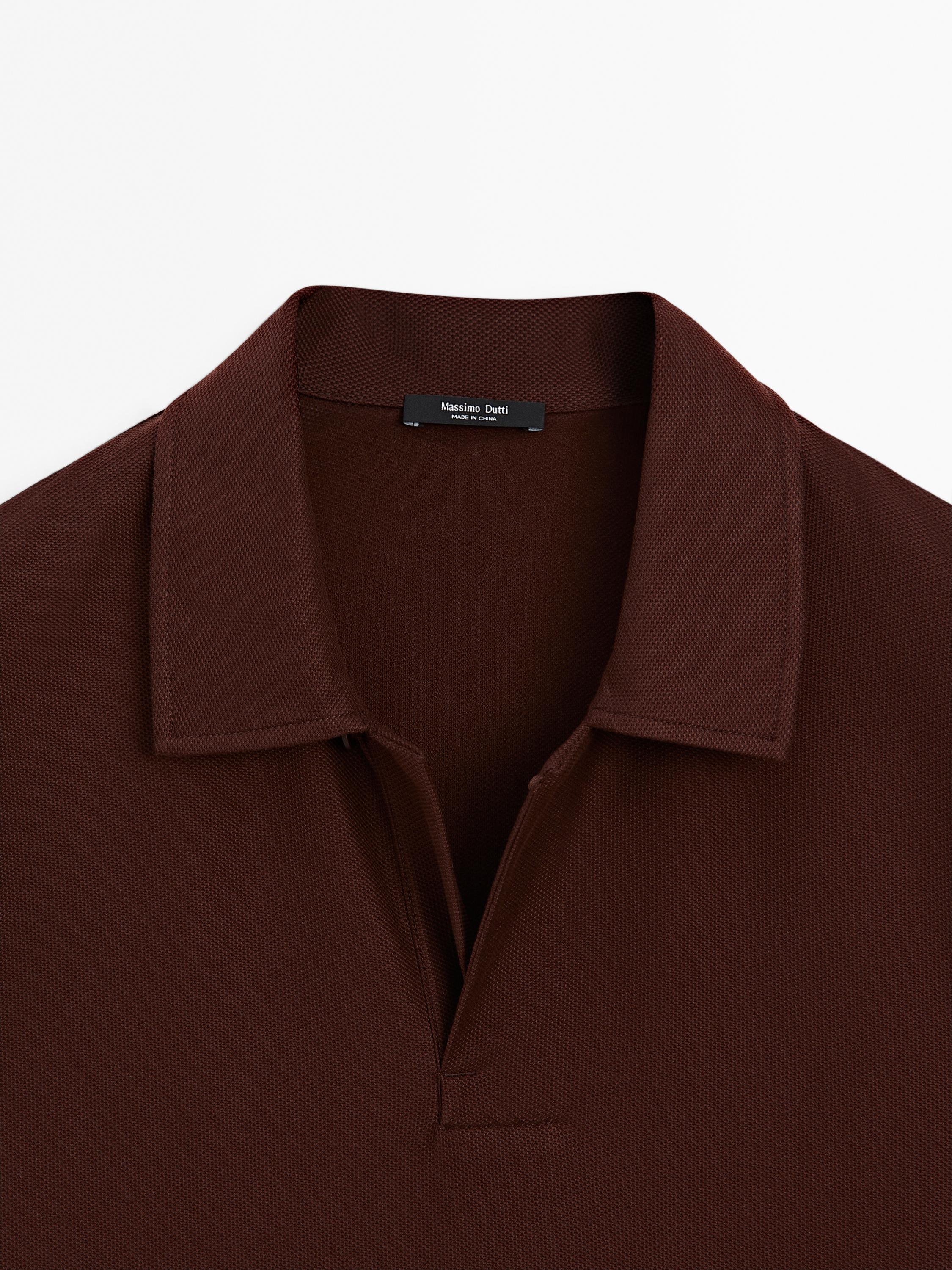 Textured polo shirt with hidden button